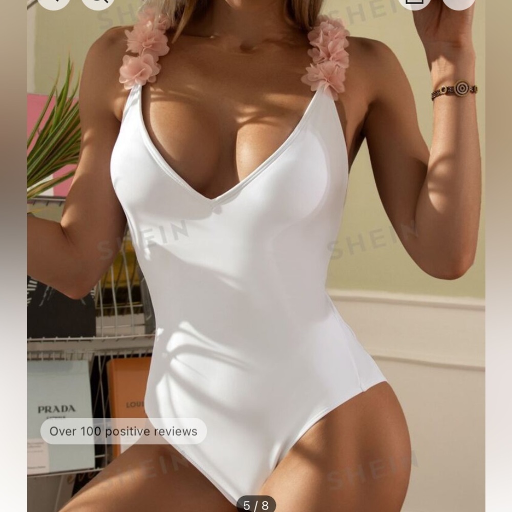 White one piece swimsuit with pink tulle